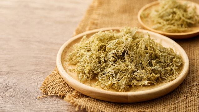 closeup furikake kelp seasoning in wood bowl on wooden table rustic food background with copy space