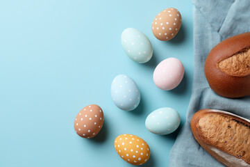 Colorful Easter eggs rest peacefully on a soft blue background, inviting spring joy and warmth Generative AI