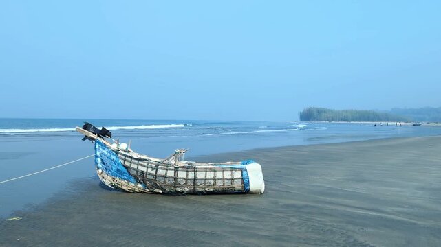 Serene Coastal View of a Rustic Wooden Boat on a Clear Day at the Seaside at cox's bazar