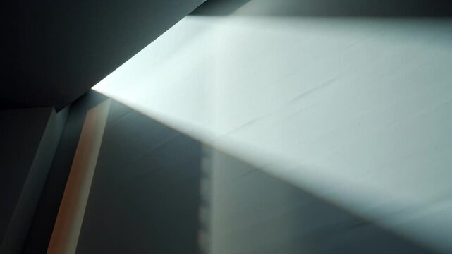 Sunlight casts shadows on a wall through a window with vector eps details.