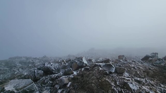 Rock and snow at Nevado de Santa Isabel create a striking landscape where bright glacier ice contrasts with dark volcanic rock, offering dramatic high-altitude views in the Colombian Andes