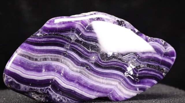 Polished purple and white chevron amethyst crystal specimen