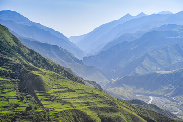 Obraz premium Blue landscape of the green terraces on high mountains in Goor, Dagestan Republic of Russia