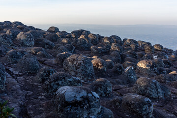 Lan Hin Pum rock formations in Phu Hin Rong Kla National Park, Thailand. Unique stone landscape with scenic mountain views. Early morning light highlights natural textures of rocks.