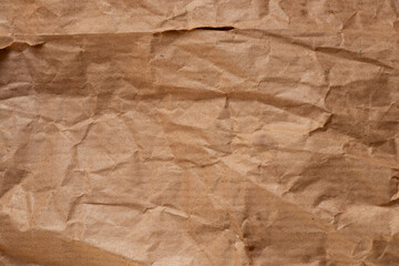 Crumpled paper bread packaging with greasy stains for the topics of food packaging, paper contamination, oil stains, and kraft paper