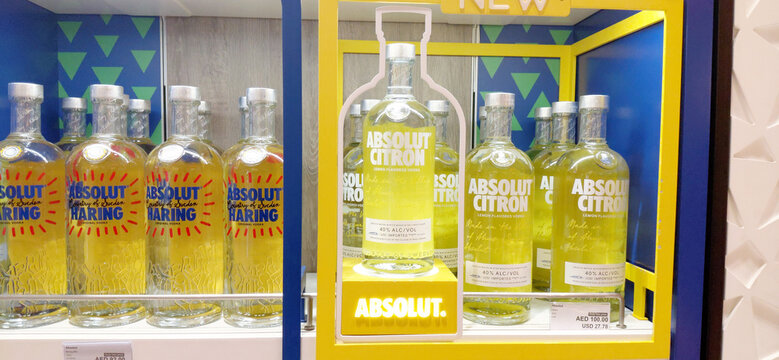 6 December 2025, Abu Dhabi, UAE: Absolut Citron and Haring special edition vodka bottles arranged on a retail display, highlighting lemon flavored spirits