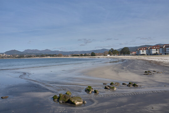 Ladeira Beach in Baiona under a sky of soft clouds reflecting the natural light of March in Galicia