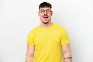 Fototapeta premium Young caucasian handsome man isolated on white background with surprise facial expression