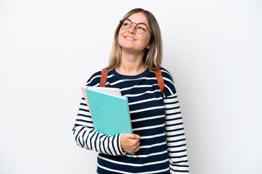 Young student Rumanian woman isolated on white background thinking an idea while looking up