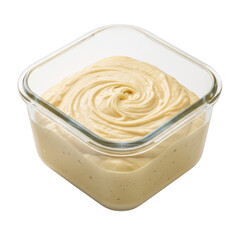 A close-up view of creamy frosting swirled inside a clear glass container