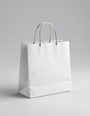 Minimalist White Paper Shopping Bag with Metal Handles Standing Upright on Neutral Gray Background for Retail Ecommerce Packaging Design Mockup