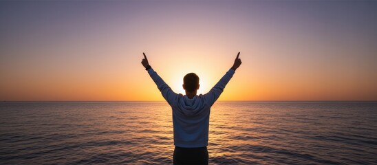 Fototapeta premium Joyful celebration of life ocean sunset outdoor photography serene environment backlit perspective positive vibes and reflection