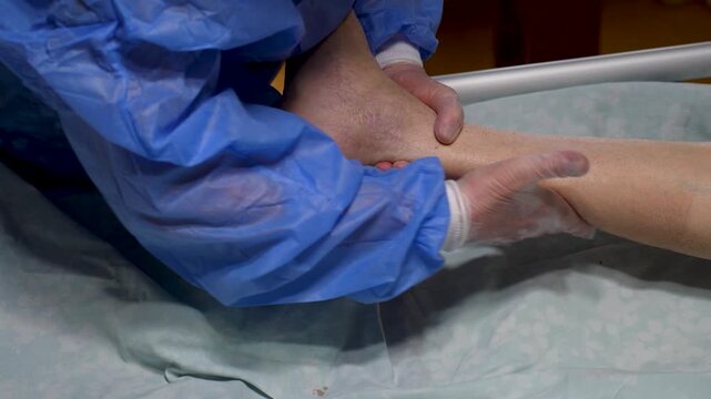 Medical Foot Massage and Joint Mobilization. Close-up of a medical professional performing manual therapy and therapeutic massage on a patient foot. Elderly care, caregiving and nursing