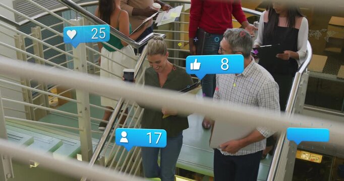 Pair of coworkers heading to lower level, tech bubbles popping from live feed and updating counts