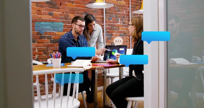 Man picking up pen, business team discussing pie chart to refine strategy, chat bubbles floating