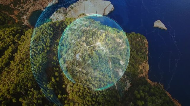 Aerial camera sweeping, holographic sphere appearing, growing, rotating, mapping headland coastline