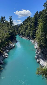 Turquoise river flowing through Hokitika Gorge, surrounded by native forest on the West Coast of New Zealand&rsquo;s South Island.