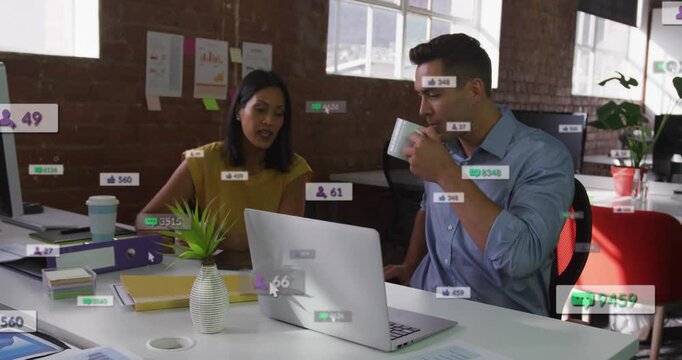 Woman pointing at laptop and man sipping mug, reviewing marketing metrics while badges growing