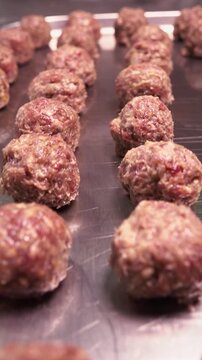 We cook meat meatballs with our own hands from raw minced meat. Vertical video