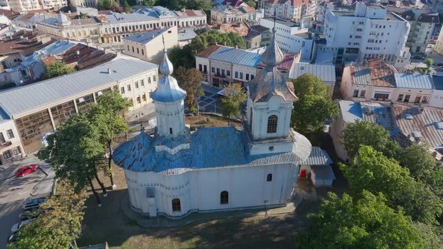 Aerial orbit of Uspenia Church during a vibrant sunset. Botoșani, Rom&acirc;nia