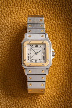Cartier Santos Galbee watch, with square case and exposed screws on the bezel and bracelet in steel and 18kt yellow gold. Milan, Italy, October 23, 2025