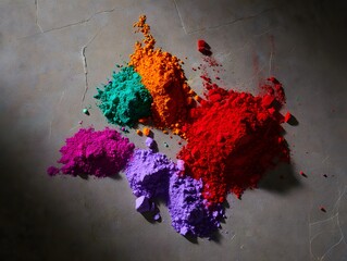 Vibrant splashes of colored powder scattered on a concrete surface