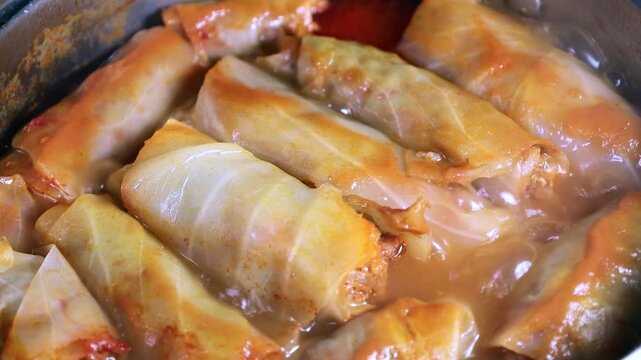 Cabbage rolls are cooked in a saucepan 4k close-up video