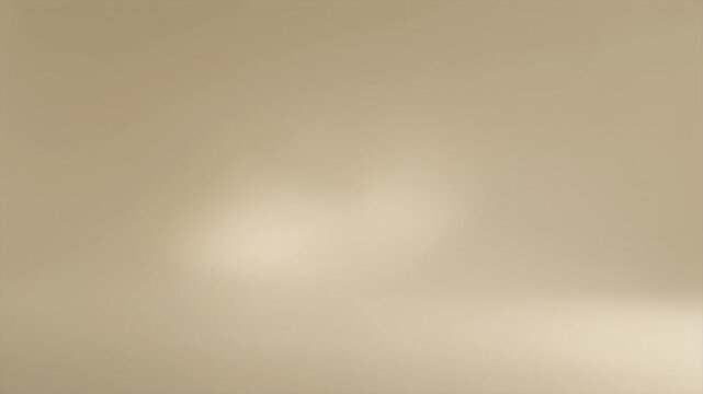 Smooth tan colored gradient background with subtle variations in light intensity