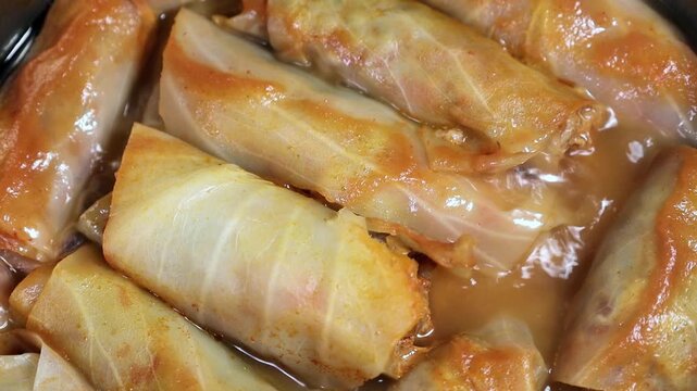 Cabbage rolls are cooked in a saucepan 4k close-up video