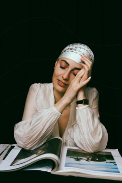 Portrait of a bald young woman with natural beauty and confident expression, isolated on neutral background. Concept of individuality, strength, self-acceptance, oncology awareness, alopecia