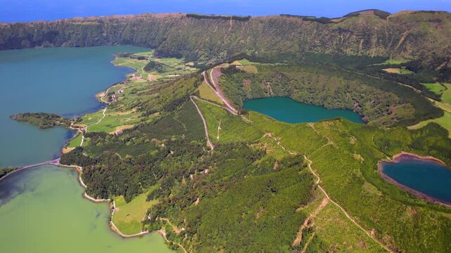 Portugal Azores Sao Miguel Boca do Inferno drone 4K flight over volcanic craters and Sete Cidades colorful twin lakes green blue lagoons aerial reveal majestic nature landscape travel video