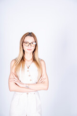 The model is posing with her hands and arms resting on the ground.