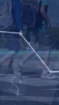 Vertical video: Two boys stepping across zebra crosswalk to school, blue overlay sweeping legs