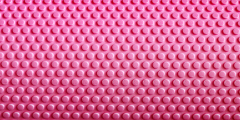 Fototapeta premium Pink Foam Roller Texture Close Up, Myofascial Release Massage Equipment Surface, Fitness Recovery Tool Background For Sport And Rehabilitation Concept