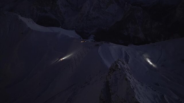 Snow Grooming, Maintaining The Ski Hills At Night In Sass Pordoi, Italy. - aerial