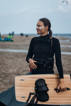 Active Woman Kitesurfing in Summer