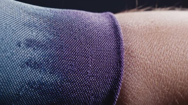 A detailed close-up shot showcasing the texture of denim jeans against human skin. Ideal for illustrating concepts of comfort, style or personal appar