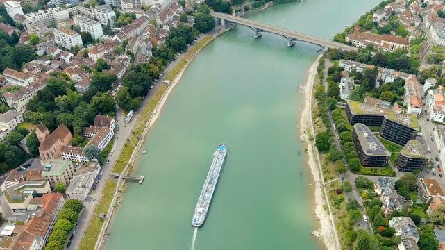 Basel, Switzerland. A tanker cargo barge floats along the Rhine River. Basel is a city on the Rhine River in Switzerland, near the borders with France and Germany. Drone footage