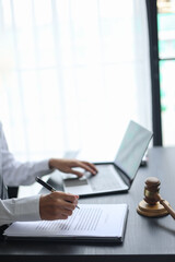Fototapeta premium Lawyer Reviewing Contract with Gavel on Desk.