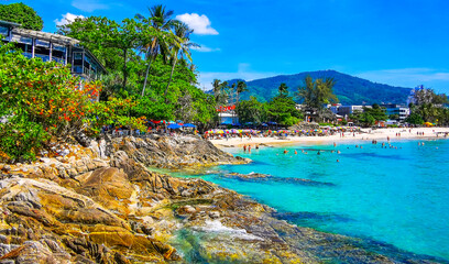 Tropical Patong Kamala Beach Phuket Thailand tourists people parasol palm. © Arkadi