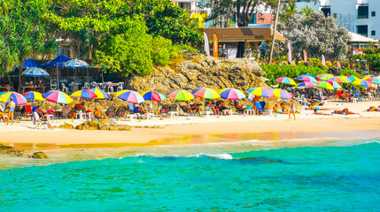 Tropical Patong Kamala Beach Phuket Thailand tourists people parasol palm. © Arkadi