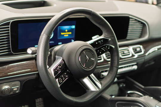 Mercedes-Benz GLS 63 AMG II X167 V8 Biturbo - interior, steering wheel, badge, front seats, central console panel, shift knob, dashboard. Black leather car interior. German premium SUV car.