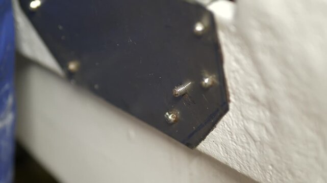Threading stainless steel bolt through boat transom plate