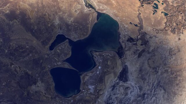 Rotating sunrise timelapse over North Aral Sea Kazakhstan satellite view from space based on Nasa imagery