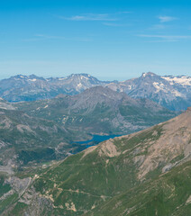 Fototapeta premium Mont-Cenis lake with peaks around from Rocciamelone mountain peak in Graian Alps in Italy