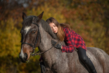 Fototapeta premium portrait of a girl with a horse