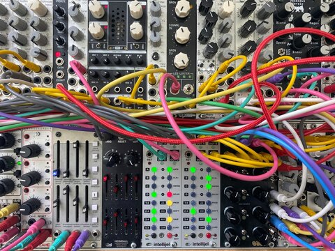 modular music synthesizer eurorack system with colorful patch cables