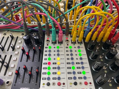 angled close up modular synthesizer eurorack with patch cables