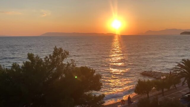 Sunset on the Adriatic coast in Croatia. Light wind, waves crashing against the shore. Fast timelapse. Vacation concept. High quality FullHD footage