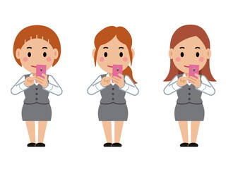 Obraz premium スマホを操作するグレー事務服の若い女性。その2